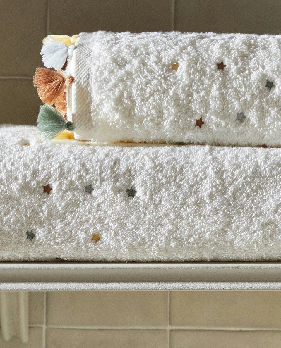 ASCIUGAMANO CON NAPPINE E STELLE 