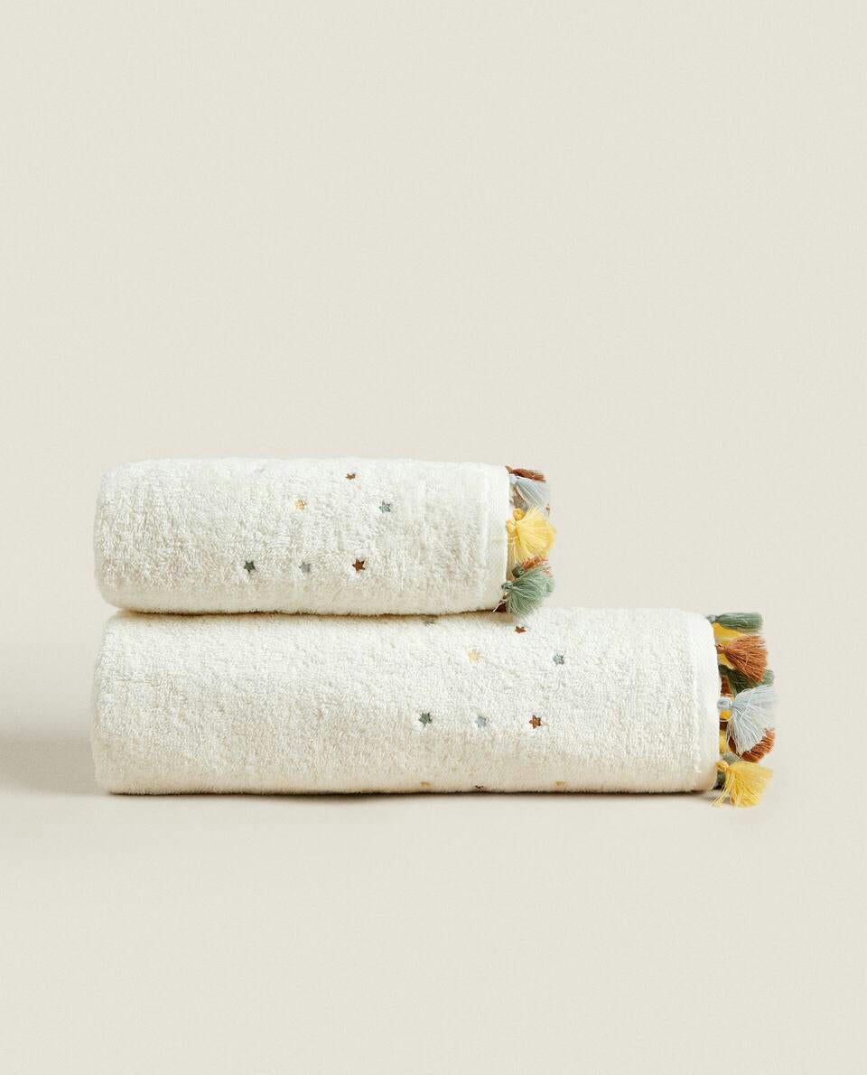 ASCIUGAMANO CON NAPPINE E STELLE 