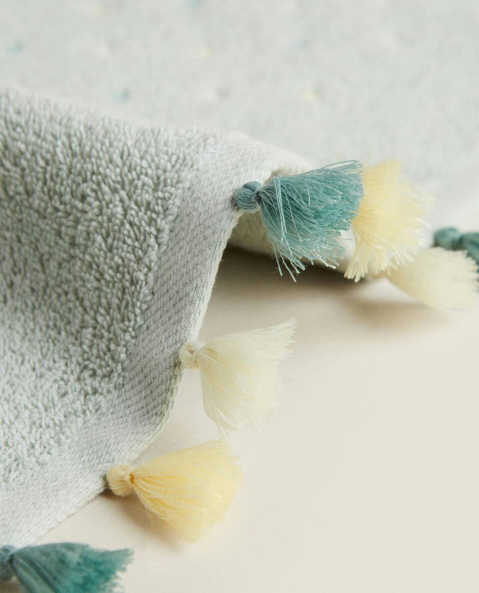 ASCIUGAMANO CON NAPPINE E STELLE 