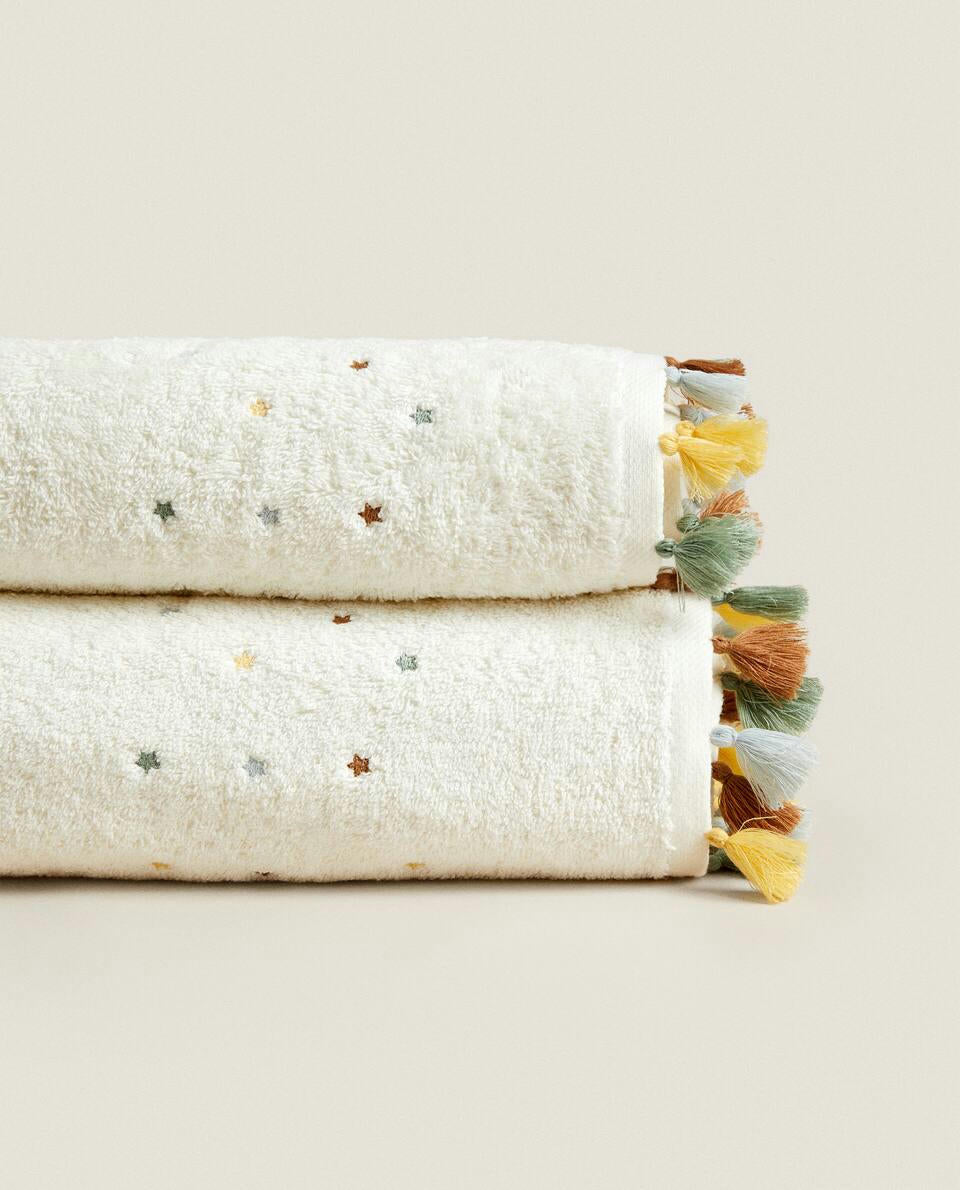 ASCIUGAMANO CON NAPPINE E STELLE 