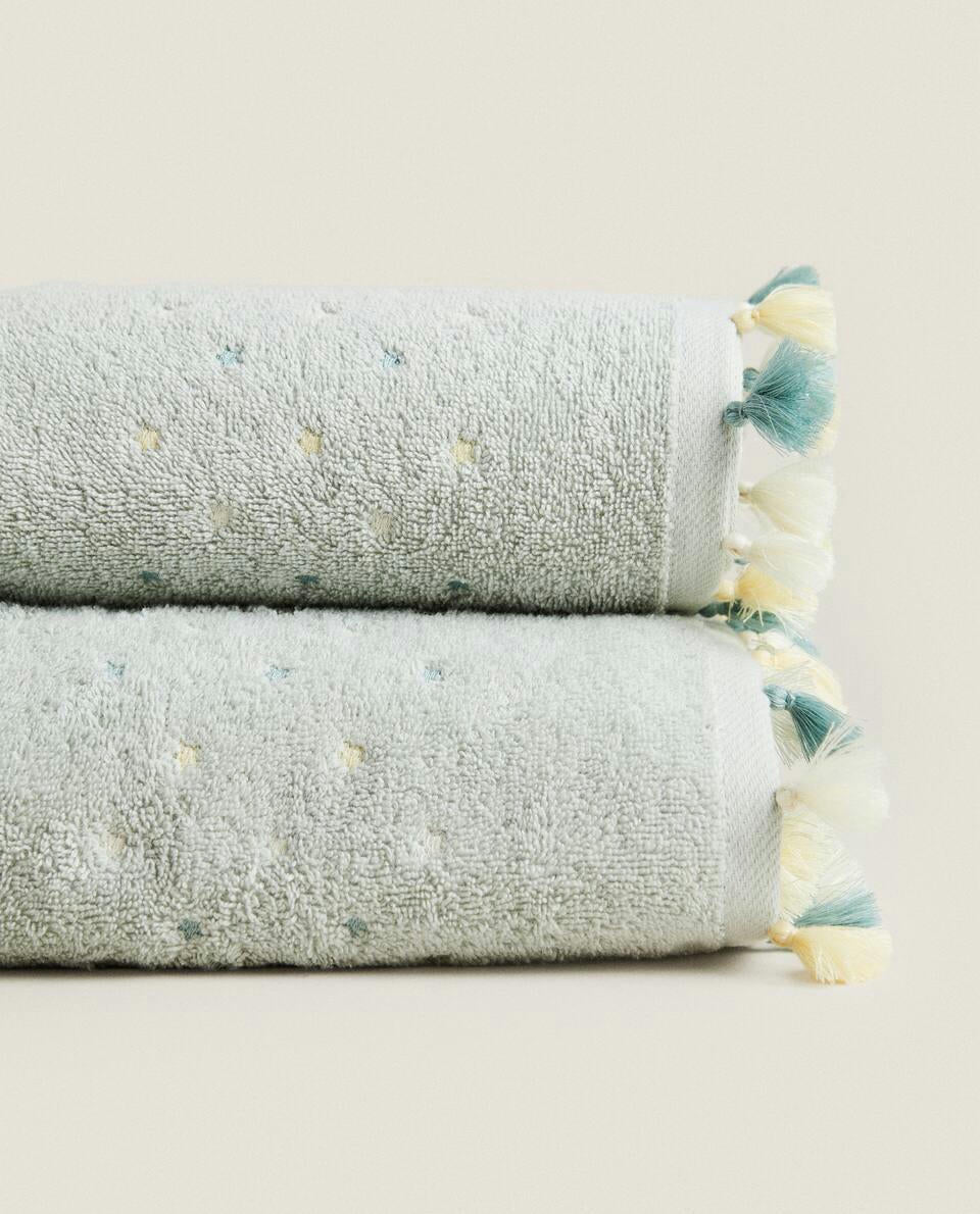 ASCIUGAMANO CON NAPPINE E STELLE 