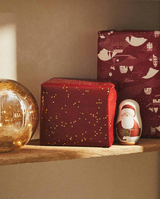 PAPEL DE REGALO CON ESTRELLAS DE NAVIDAD 